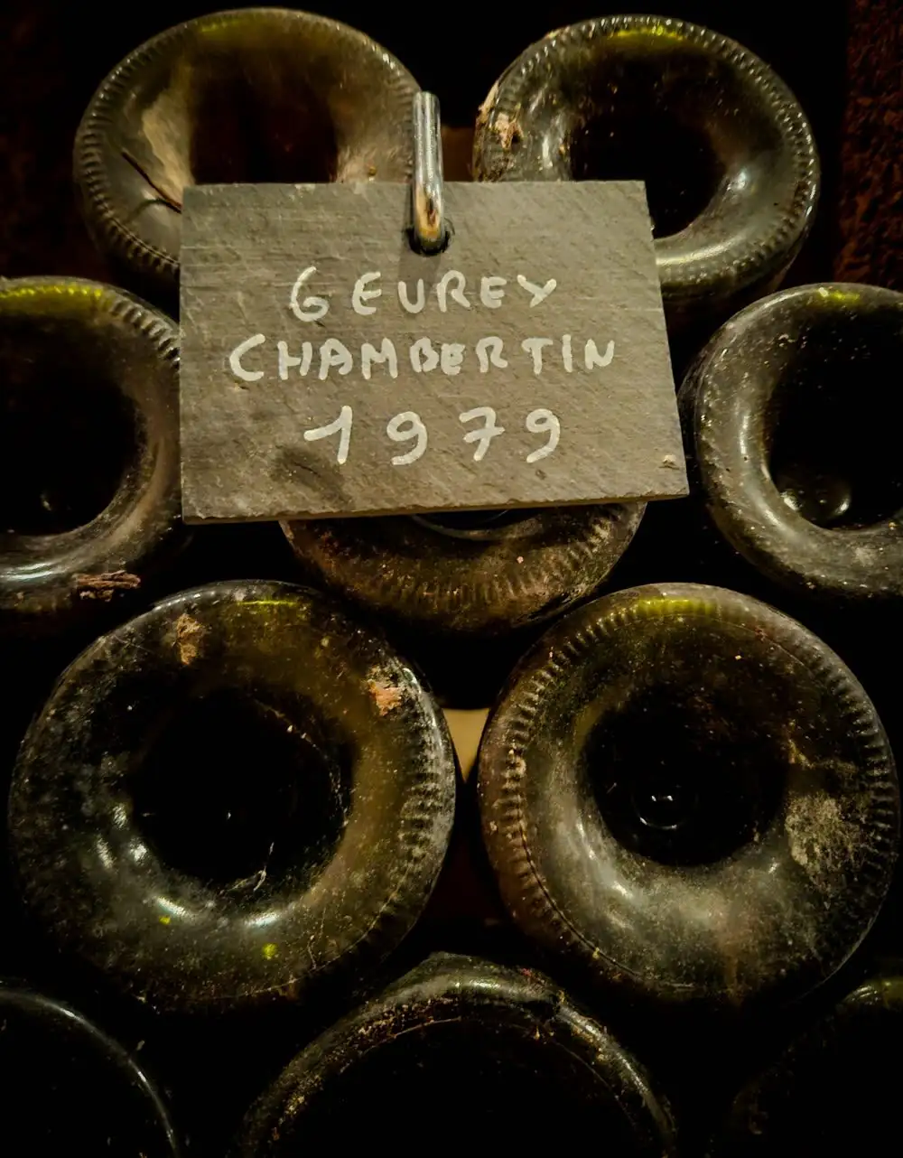 Old bottles of Gevrey-Chambertin 1979 under a slate label
