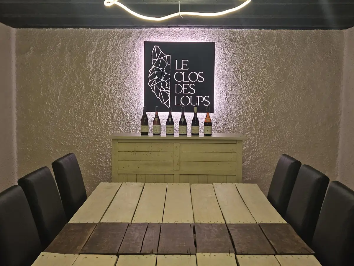 The tasting cellar at Le Clos des Loups, with six bottles set out